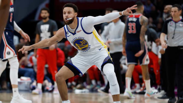 Golden State Warriors guard Stephen Curry (30) gestures at Warriors guard Jordan Poole (not pictured) after a three point field goal against the Washington Wizards in the final minute of the fourth quarter at Capital One Arena.
